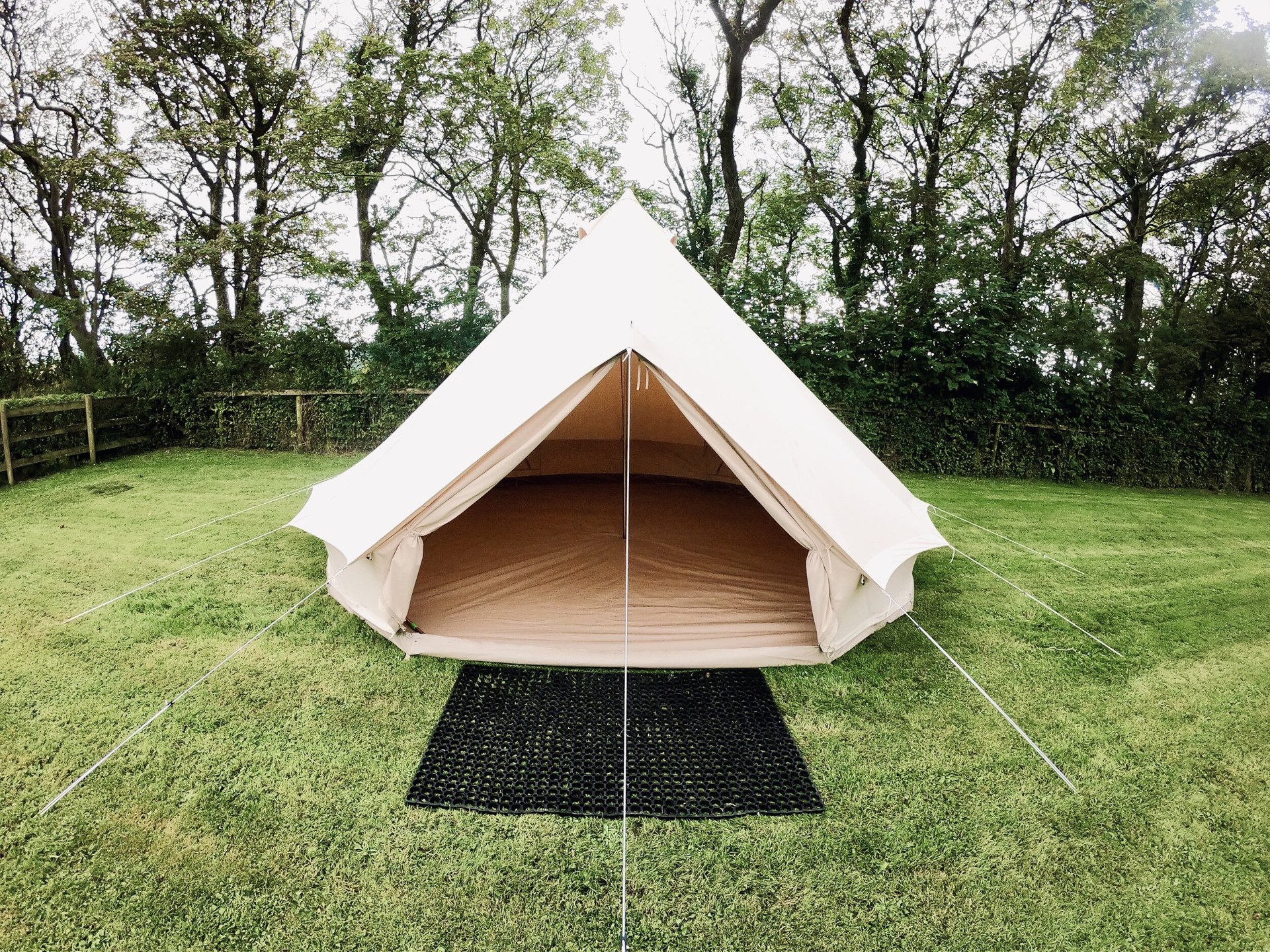 Unfurnished Gecko Glamping bell tent with an open entrance